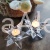 swiecznik szklany na tealight gwiazdka.jpg